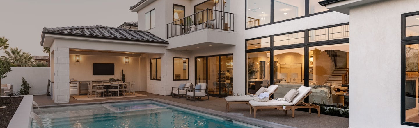 modern home with windows walls and pool