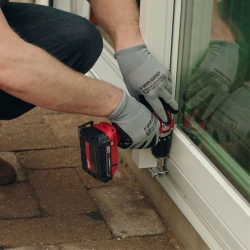contractor working on installing andersen patio door